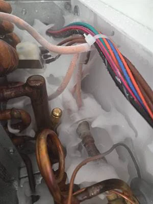 Evaporator coil iced over inside the ice cream freezer